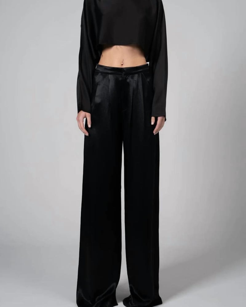 Front of a model wearing a size L Paris Pant in Black in Black by NONCHALANTLABEL. | dia_product_style_image_id:339480